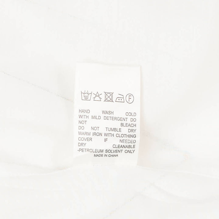 Club21 Collection sheer black long-sleeve button-up blouse with draped gathered collar and wide contrast cuffs, displayed flat on a white background
