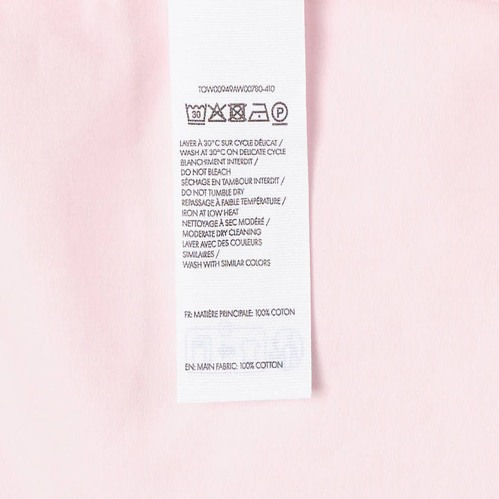 Jacquemus La Haut Drap sleeveless woven top in pale pink with structured shoulder seams, side zip detail, and navy brand label at the neckline - view 3