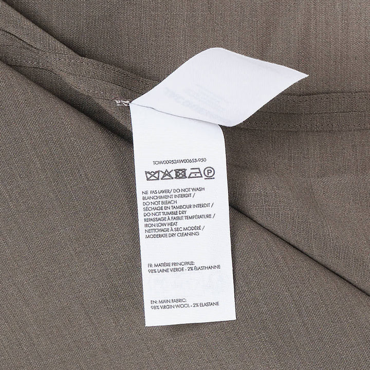 Jacquemus Havana Woven Belted Top in taupe, featuring a high turtleneck collar, wide elbow-length sleeves, and a long self-tie fabric belt at the gathered hem, displayed flat on a white background - view 3