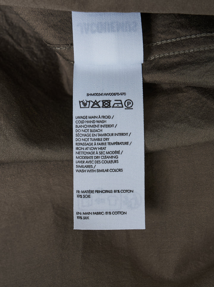 Jacquemus Simon long sleeve shirt in taupe with a lustrous crinkled finish, concealed button placket and small script embroidery at the hem - view 4
