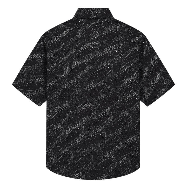 Jacquemus La Chemise Rio short sleeve shirt in black with an all-over white hand-drawn fish print and mother-of-pearl button fastening - view 2