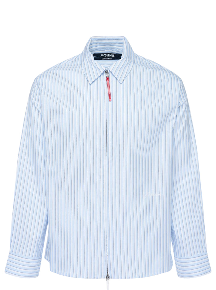Jacquemus La Chemise Flash light blue and white striped zip-front shirt with red leather zip pull and pointed collar