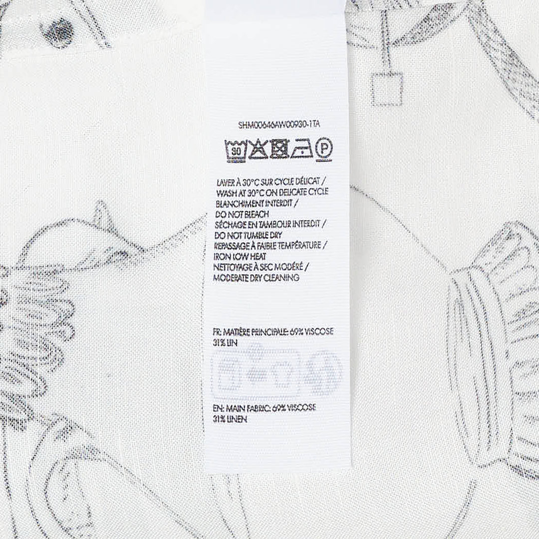Jacquemus La Chemise Cocktail short sleeve shirt in white with an all-over monochrome hand-drawn still-life sketch print featuring shells, fish, fruit, and ribbon motifs, camp collar, and button-through front fastening - view 3