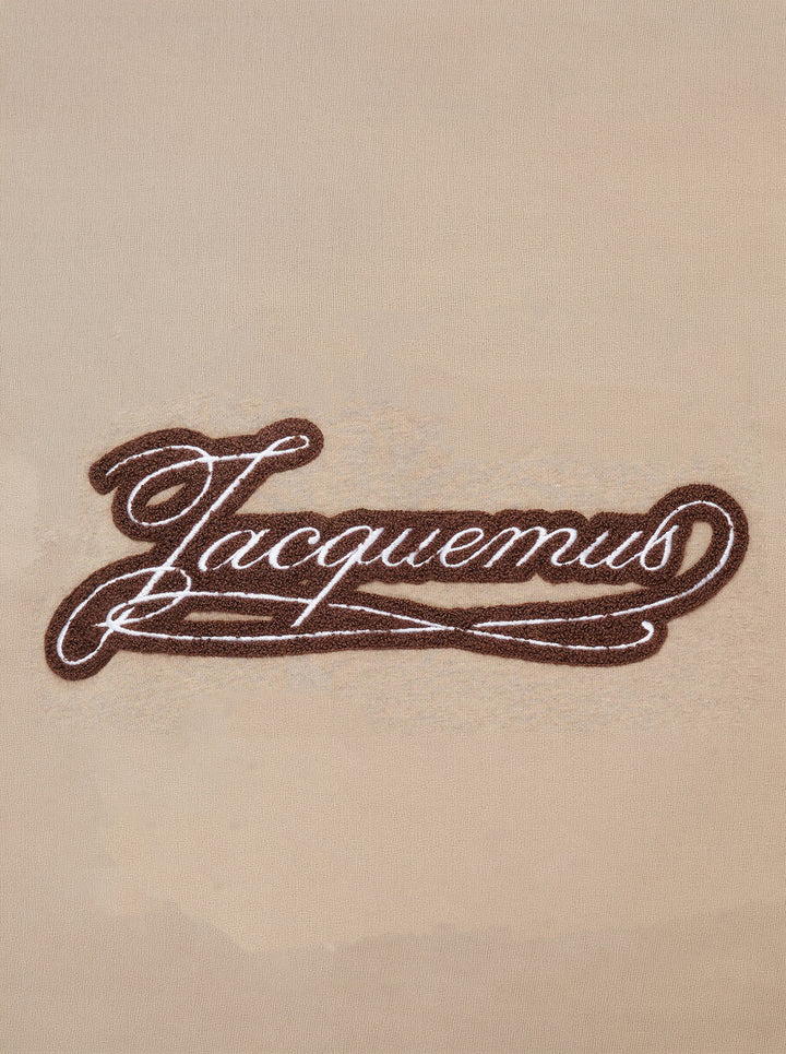 Jacquemus Torneo sweatshirt in taupe with ribbed mock neck and a Le Palmier palm illustration label at the hem - view 4