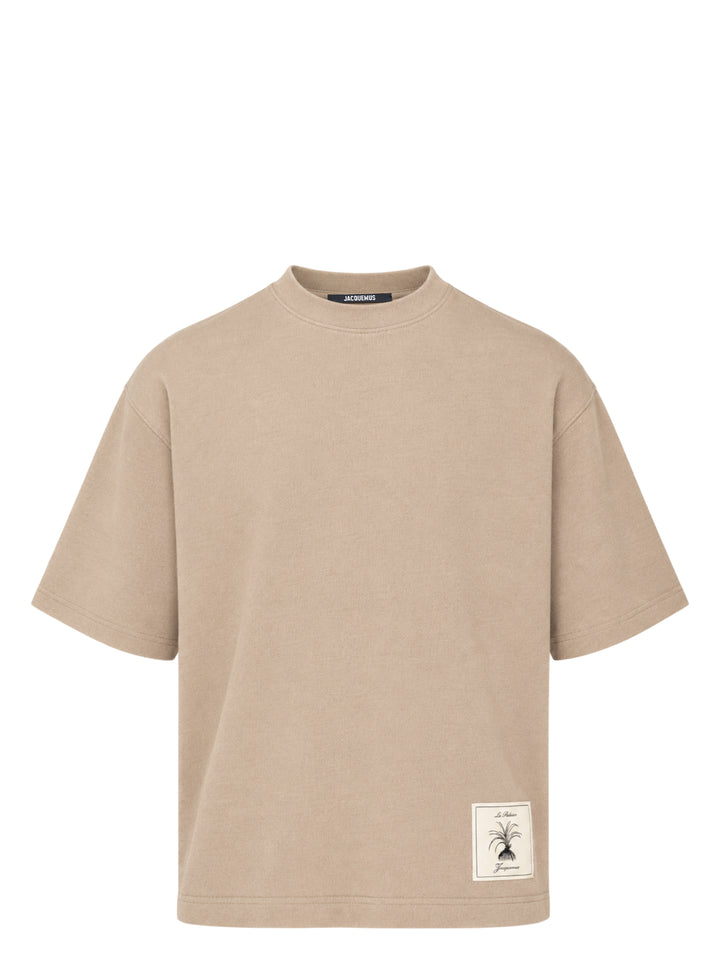 Jacquemus Le T-shirt Torneo short sleeve tee in taupe with a woven botanical label at the hem