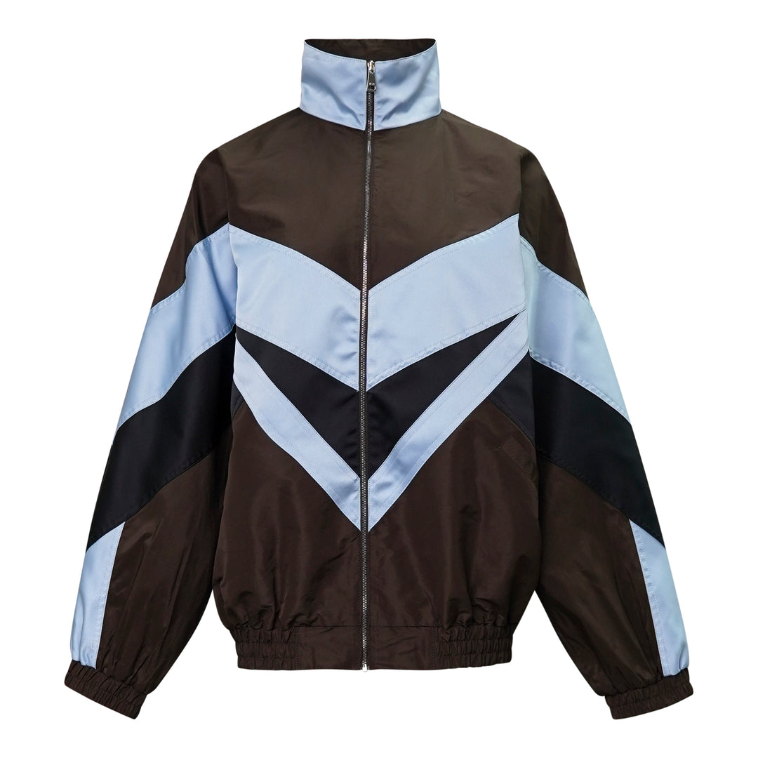 N°21 oversized sports blouson in dark brown and powder blue with bold navy chevron colourblock panels, funnel neck, and full-length zip closure