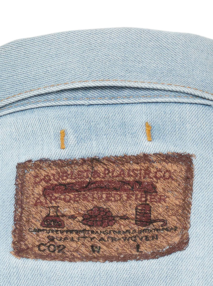 doublet Air Yarn Faded Denim Jacket in light-wash blue with archival printed patch labels on the chest pocket and cuff, featuring amber topstitching and gunmetal button fastening - view 5