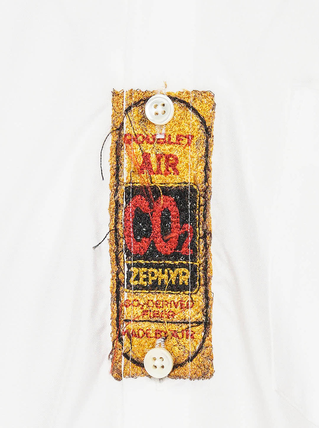 doublet Air Yarn Long Sleeve Shirt in white with embroidered CO2 Zephyr patch on the chest and repeated CO2 stamp graphic on the lower front, shown flat on a white background - view 3