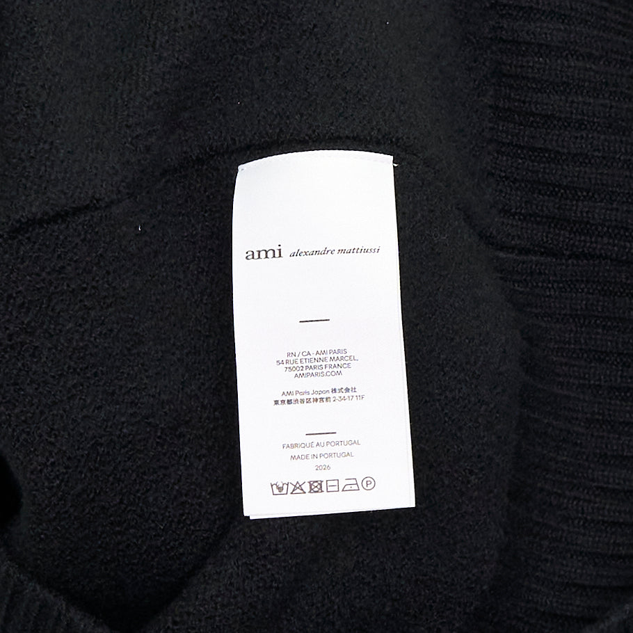 Ami Alexandre Mattiussi black V-neck cardigan with red intarsia-knit Ami de Cœur heart logo on the chest, button front closure, and ribbed trims