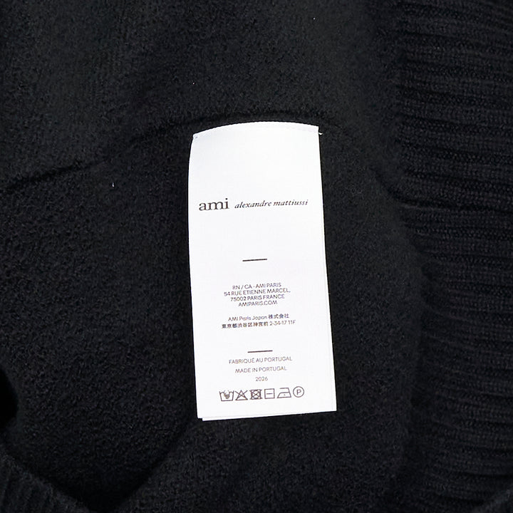 Ami Alexandre Mattiussi black V-neck cardigan with red intarsia-knit Ami de Cœur heart logo on the chest, button front closure, and ribbed trims