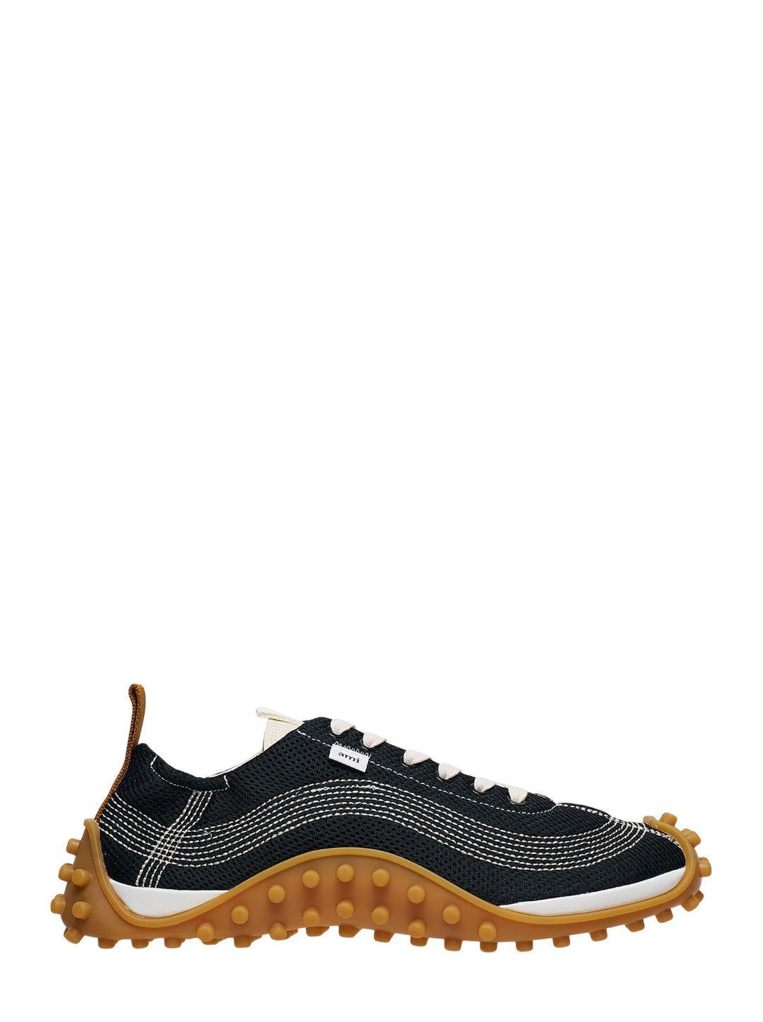 Ami Mirage Sneakers in black mesh with white contrast topstitching, cream laces, and a chunky tan gum rubber outsole with dome studs, side profile view
