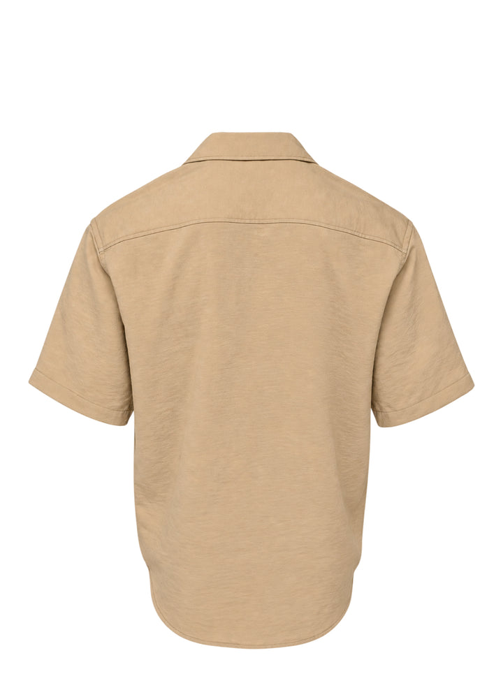 AMI Alexandre Mattiussi short sleeve boxy shirt in beige with camp collar, white shell buttons, and tonal AMI script embroidery at the chest - view 2