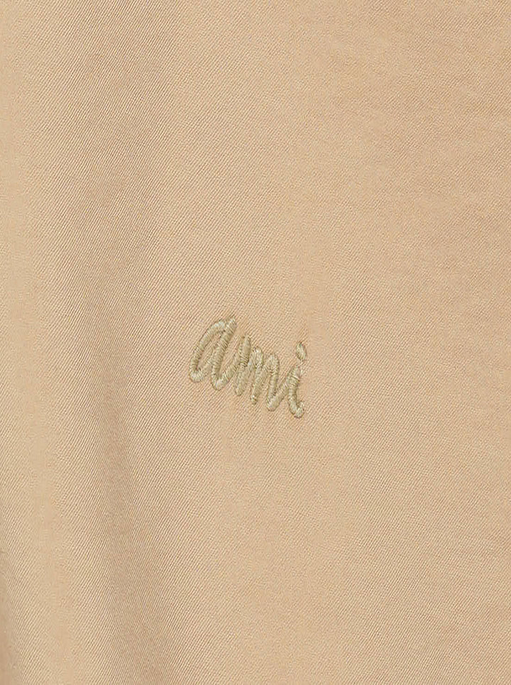 AMI Alexandre Mattiussi short sleeve boxy shirt in beige with camp collar, white shell buttons, and tonal AMI script embroidery at the chest - view 3