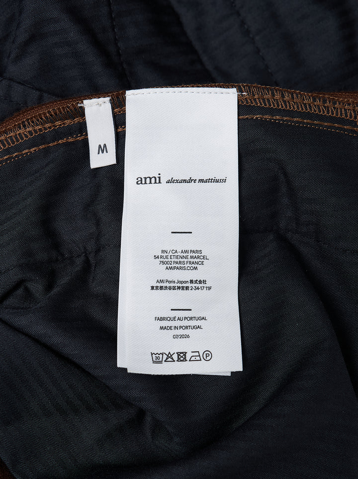 AMI Parisian Fit Trousers in brown fine-wale corduroy with a straight leg silhouette, structured waistband and twin button fastening, front view on white background - view 3