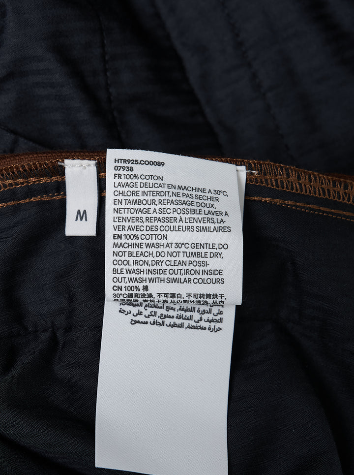 AMI Parisian Fit Trousers in brown fine-wale corduroy with a straight leg silhouette, structured waistband and twin button fastening, front view on white background - view 4