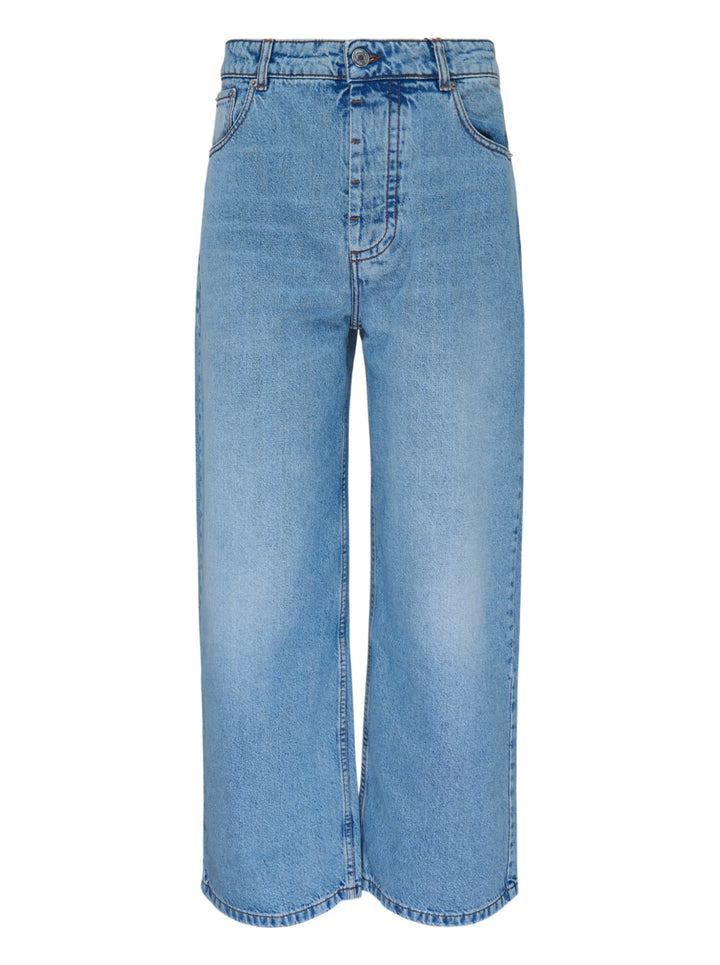 AMI Baggy Fit Jeans in light blue washed denim with wide-leg silhouette, button fly, and five-pocket design