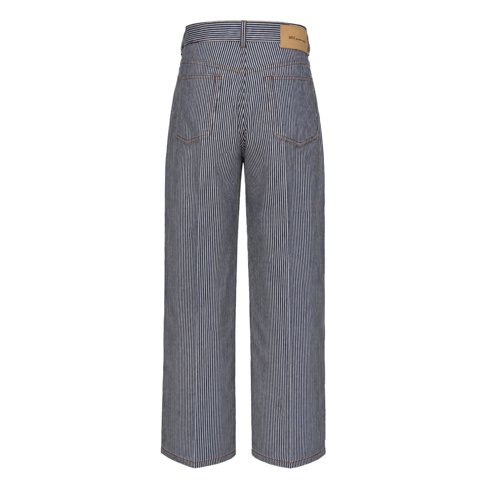 AMI Baggy Fit Striped Jeans in navy and white hickory stripe denim, featuring a high rise, wide-leg silhouette, five-pocket construction, and contrast amber topstitching