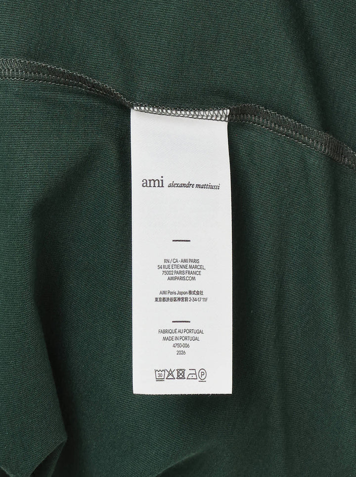 AMI Alexandre Mattiussi Bicolor Ringer Tee in forest green with cream contrast ribbed trim at the neckline and cuffs, and Ami de Cœur logo embroidered at the chest - view 4