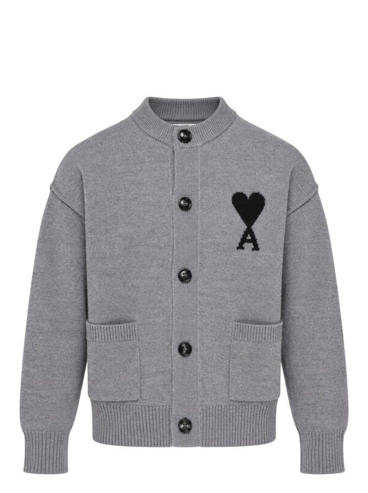 AMI grey crewneck cardigan with intarsia Ami de Cœur logo, button-front closure, ribbed trims, and hip patch pockets
