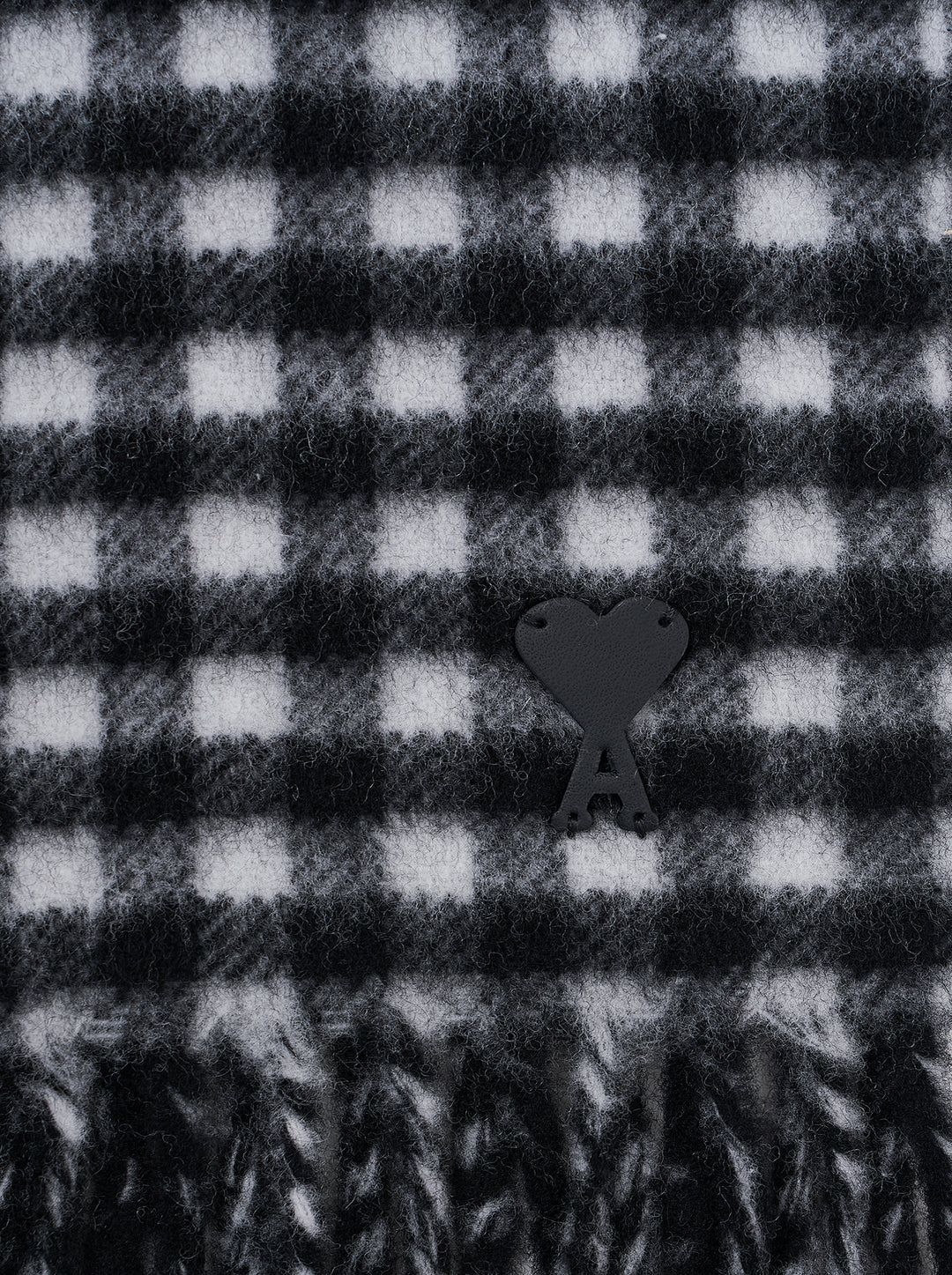 AMI Ami de Coeur black and white gingham check scarf with fringed ends, laid flat against a white background - view 2
