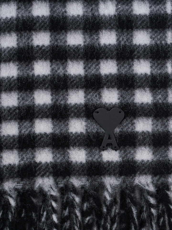 AMI Ami de Coeur black and white gingham check scarf with fringed ends, laid flat against a white background - view 2