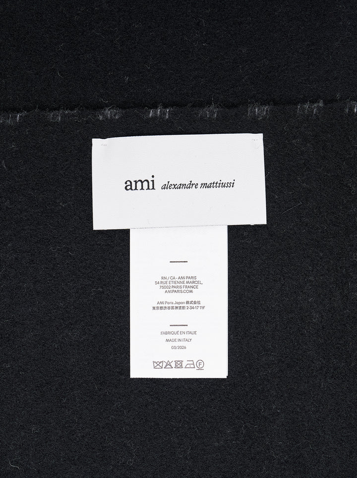AMI Ami de Coeur black and white gingham check scarf with fringed ends, laid flat against a white background - view 3