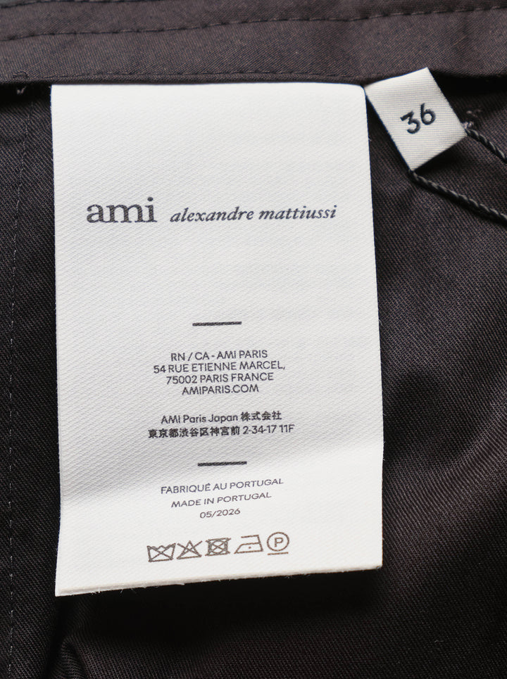 AMI Pleated Carrot Shorts in medium grey, featuring a high-rise waistband, double forward pleats, wide-leg carrot silhouette, and cuffed hem, displayed flat on a white background. - view 3