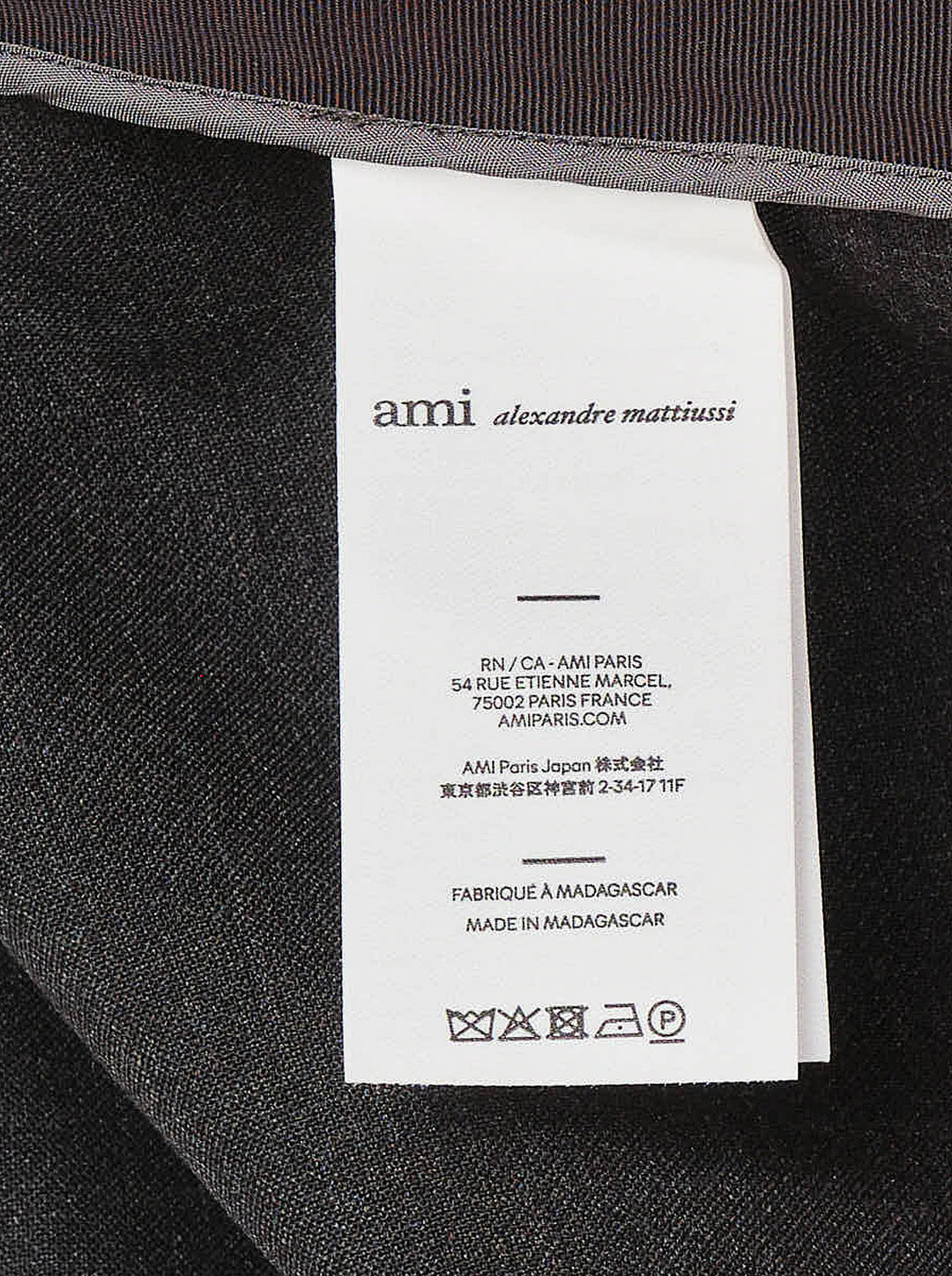AMI sleeveless peplum top in charcoal grey with a scoop neckline and flared, pleated peplum hem - view 3