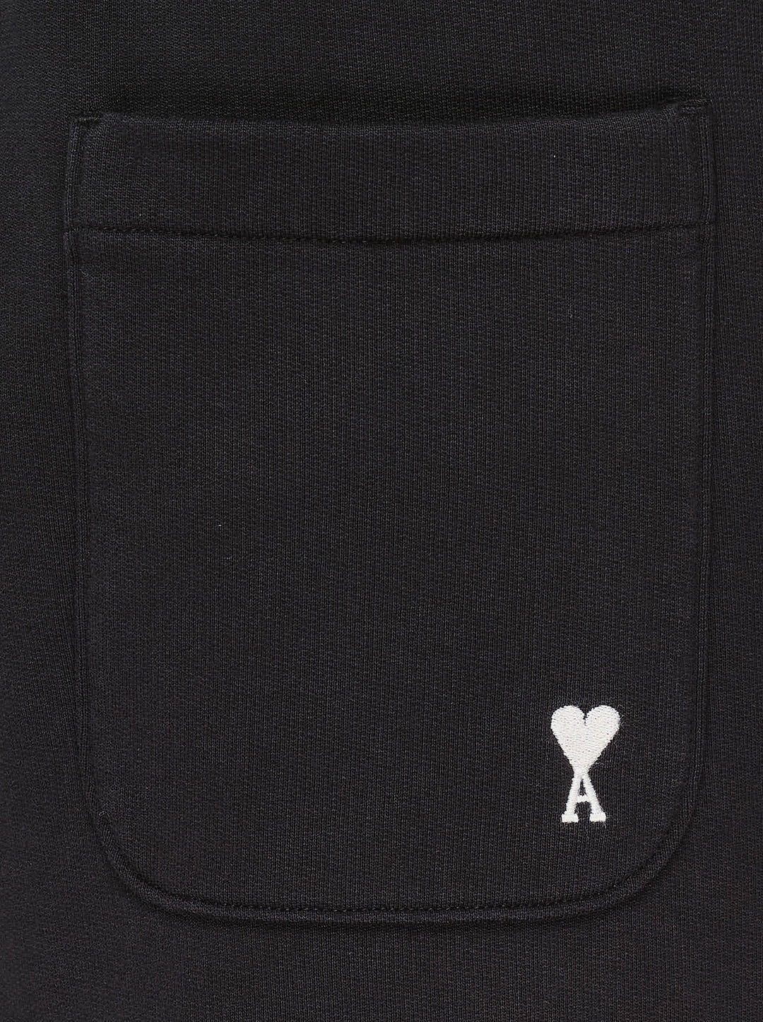 AMI black drawstring sweatpants with ribbed waistband and wide straight leg, shown from the front - view 3