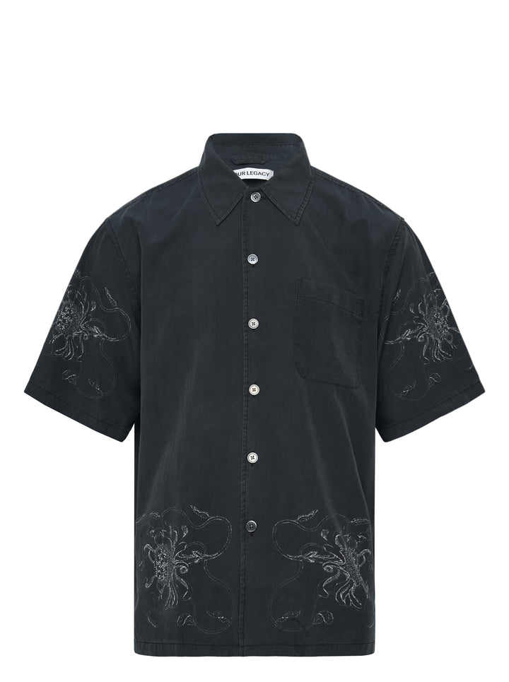 Our Legacy Every Short Sleeve Shirt in washed black with tonal floral embroidery on both sleeves and lower hem, featuring a boxy fit and pearlescent button fastening