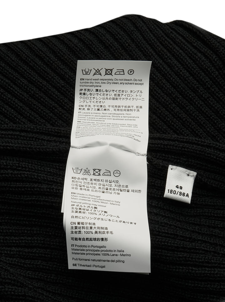 Our Legacy Compact Round Neck ribbed knit sweater in black with mock neck collar and long sleeves, front view on white background - view 3