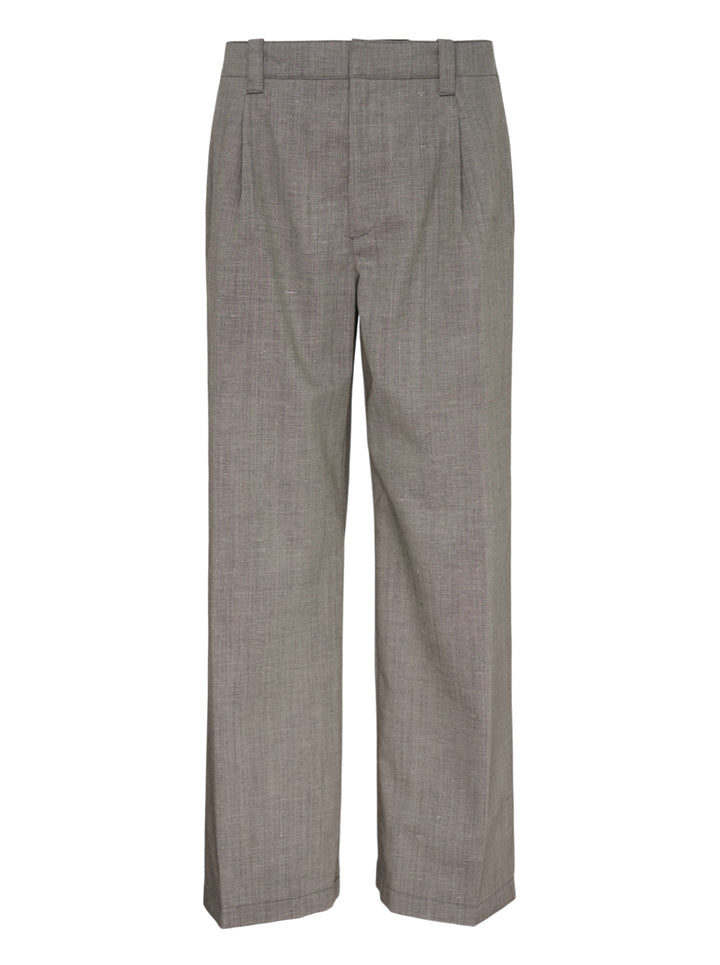 Our Legacy Still Chino Pants in heathered grey — wide-leg tailored trousers with double pleats and turn-up cuffs, front view on white background