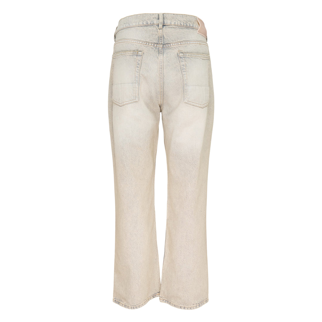 Our Legacy Third Cut Jeans in a heavily faded sandy beige wash with blue tonal shifts, featuring a high-rise waist, straight leg and cropped flare hem, shown flat on a white background