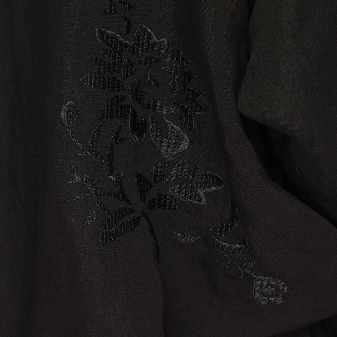Yohji Yamamoto Tuck & Drape Blouse in black, featuring an asymmetric draped hem, button-through front, point collar, and long sleeves with buttoned cuffs - view 3