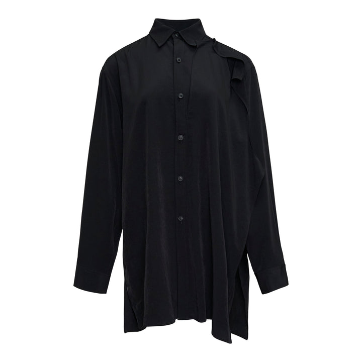 Y's black double cloth button-front blouse with asymmetric draped ruffle at the shoulder, oversized silhouette, long sleeves, and side hem slits
