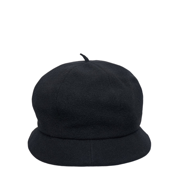 Y's black wool beret cap with a rounded dome crown, small fabric pip at the apex, and a soft downward-curved unstructured brim, photographed on a white background - view 2