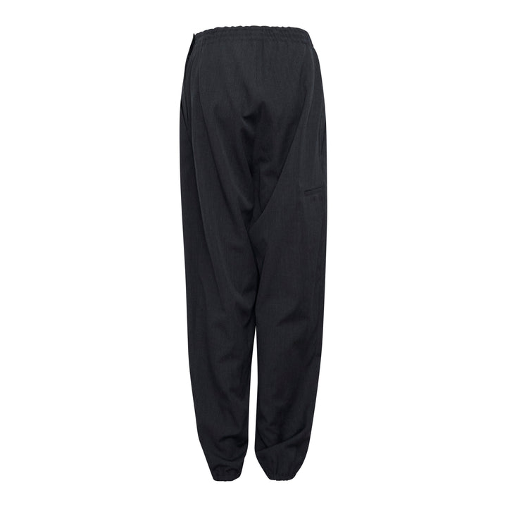 Y's black relaxed-fit drawstring joggers with drop-crotch silhouette, elasticated high-rise waistband with tonal tie, and gathered ankle cuffs, displayed flat on a white background