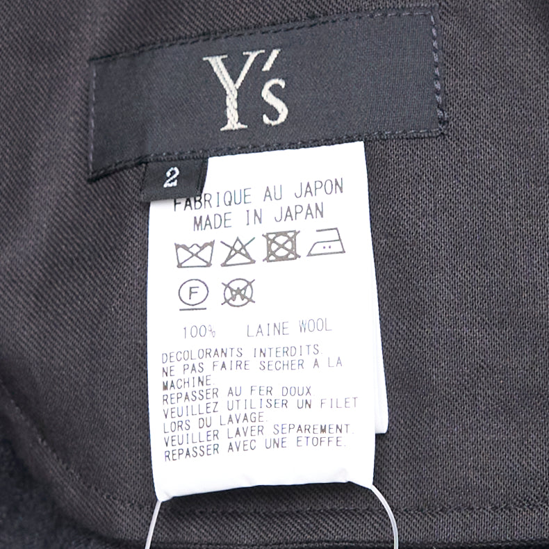 Y's black relaxed-fit drawstring joggers with drop-crotch silhouette, elasticated high-rise waistband with tonal tie, and gathered ankle cuffs, displayed flat on a white background