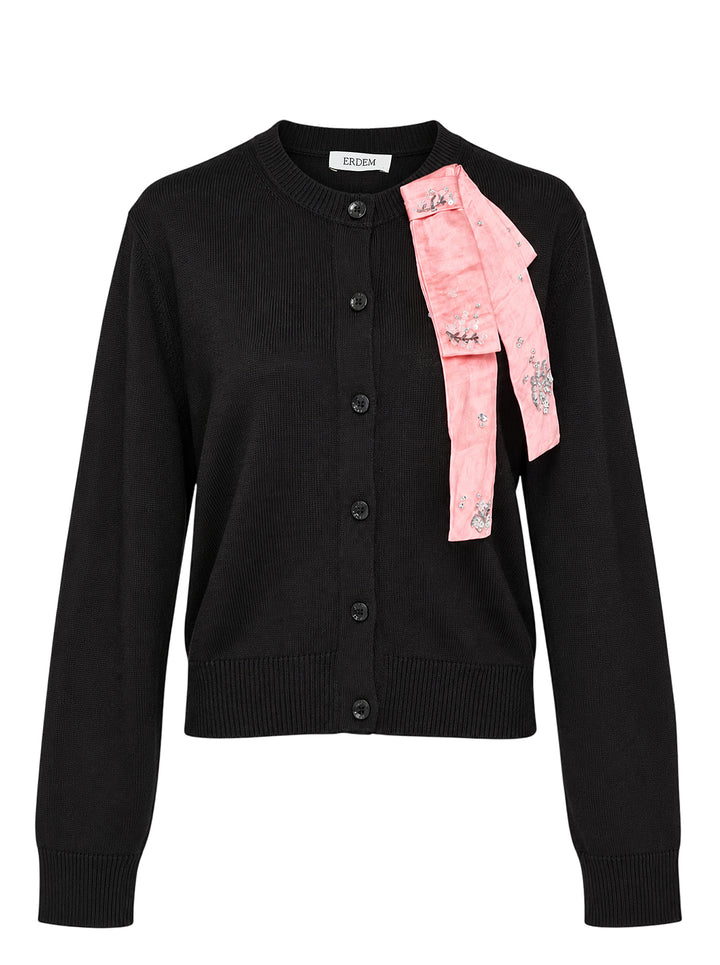 Erdem black merino wool cardigan with button-down front and a pink embellished ribbon bow draped from the neckline