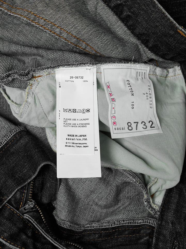sacai belted wide-leg barrel jeans in washed black denim with deep front pleats, contrast stitching, and tapered hem, photographed flat on white background - view 3