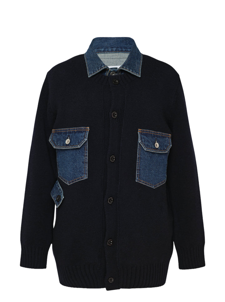 sacai Denim Contrast Wool Knit Cardigan in navy, featuring an indigo denim collar, double chest patch pockets with snap closures, and a button-front fastening