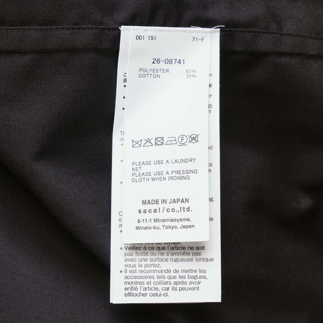 sacai black poplin long sleeve shirt with concealed front placket, point collar, chest pocket, and button-fastened cuffs, shown flat on white background - view 3