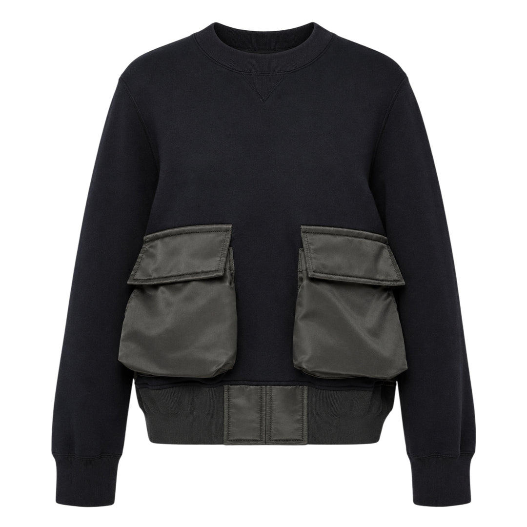 sacai Sponge Sweat Cargo Pullover in black with contrast olive nylon cargo pockets and bomber-style nylon hem panel, front view