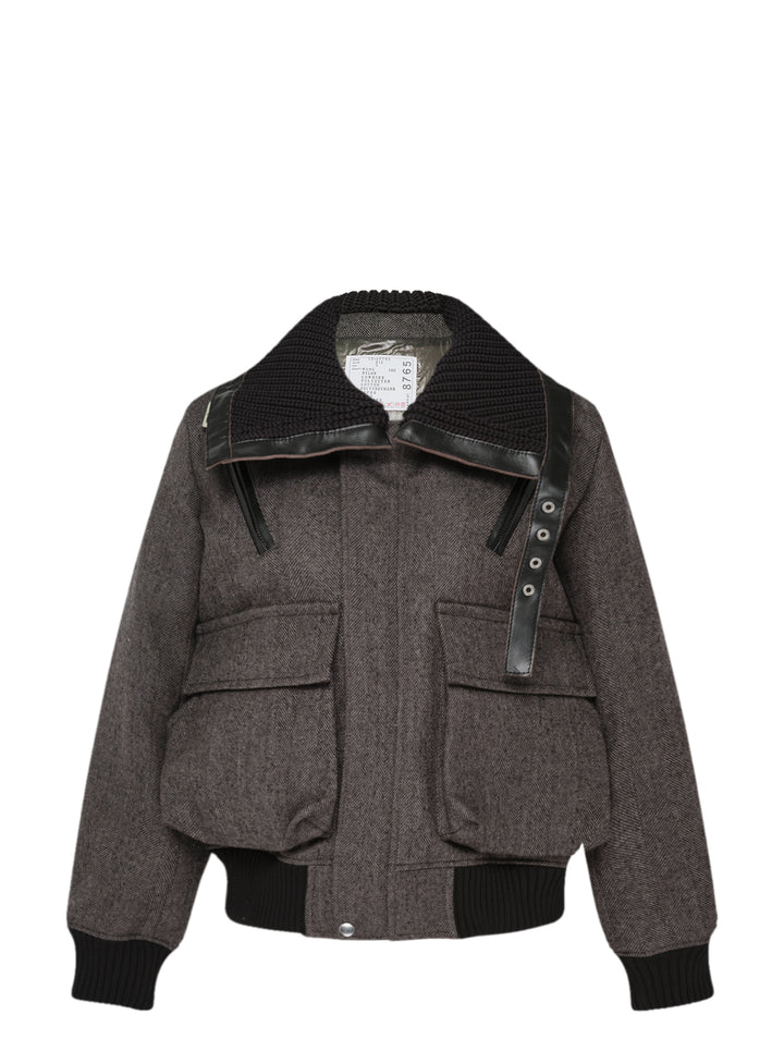 sacai double-faced herringbone bomber jacket in grey with black chunky knit collar, leather trim, asymmetric snap placket, and ribbed cuffs and hem