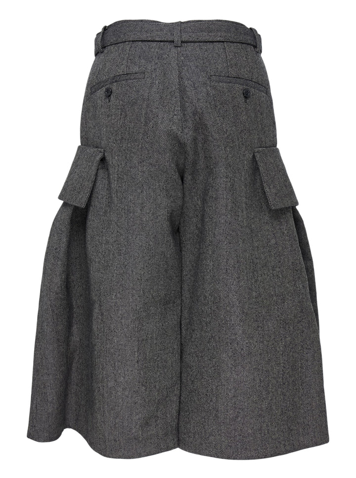 sacai Double-Faced Herringbone Midi Skirt in charcoal grey, featuring voluminous pleats, dual cargo patch pockets, and a black leather adjustable belt at the waist - view 2