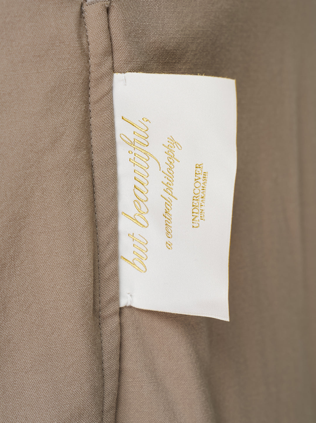 Undercover taupe cupro pants with relaxed straight leg, curved seams and a turquoise waistband button - view 3