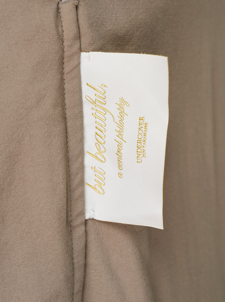 Undercover taupe cupro pants with relaxed straight leg, curved seams and a turquoise waistband button - view 3