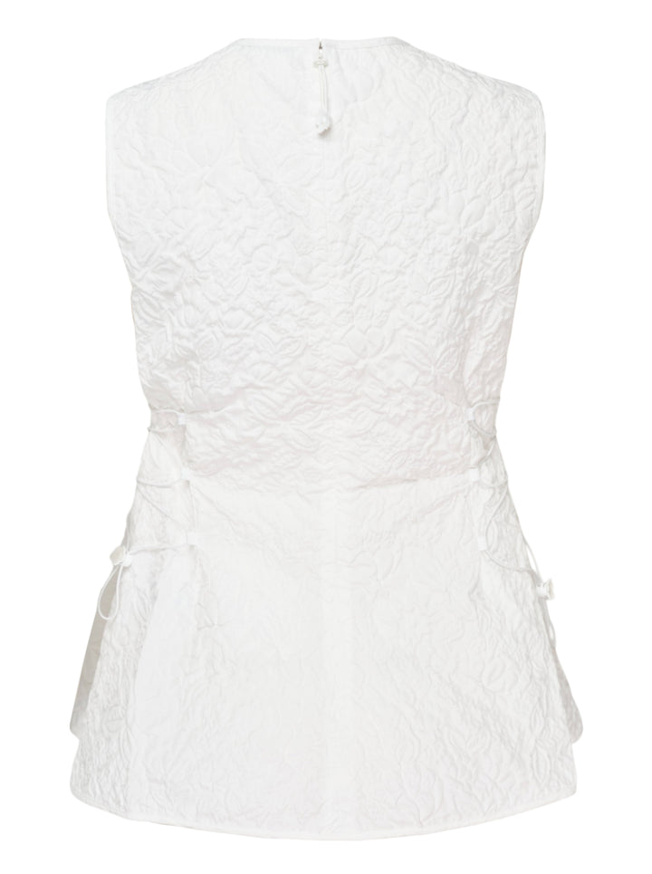 Cecilie Bahnsen Floratini Matelassé sleeveless top in white, shown from the back, featuring an all-over raised floral quilted pattern, gathered bow details along both side seams, and a concealed back zip closure - view 2