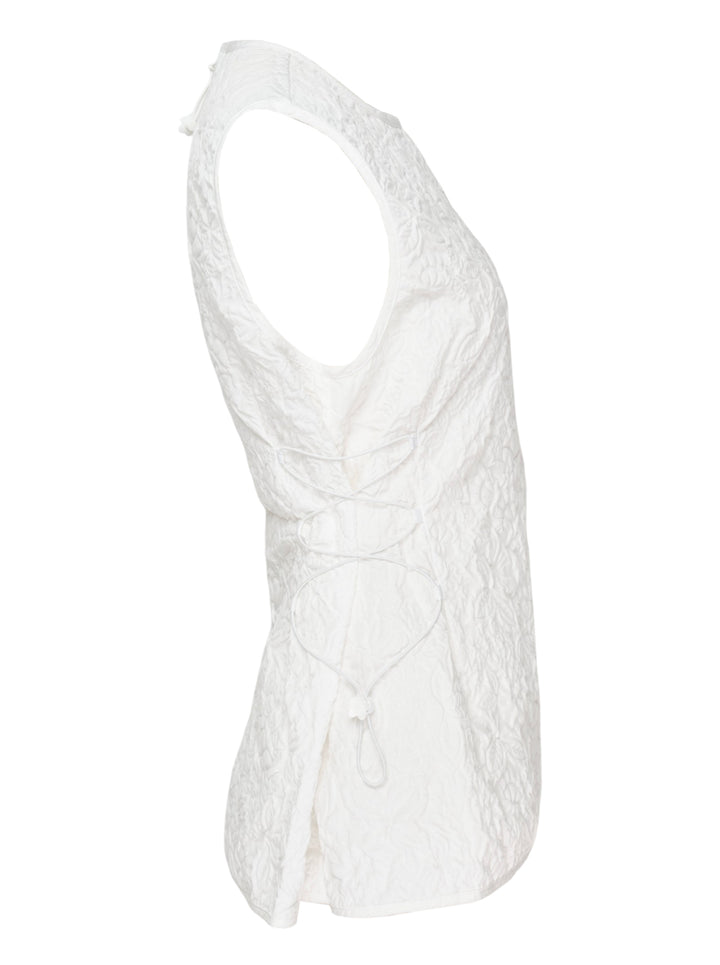 Cecilie Bahnsen Floratini Matelassé sleeveless top in white, shown from the back, featuring an all-over raised floral quilted pattern, gathered bow details along both side seams, and a concealed back zip closure - view 4