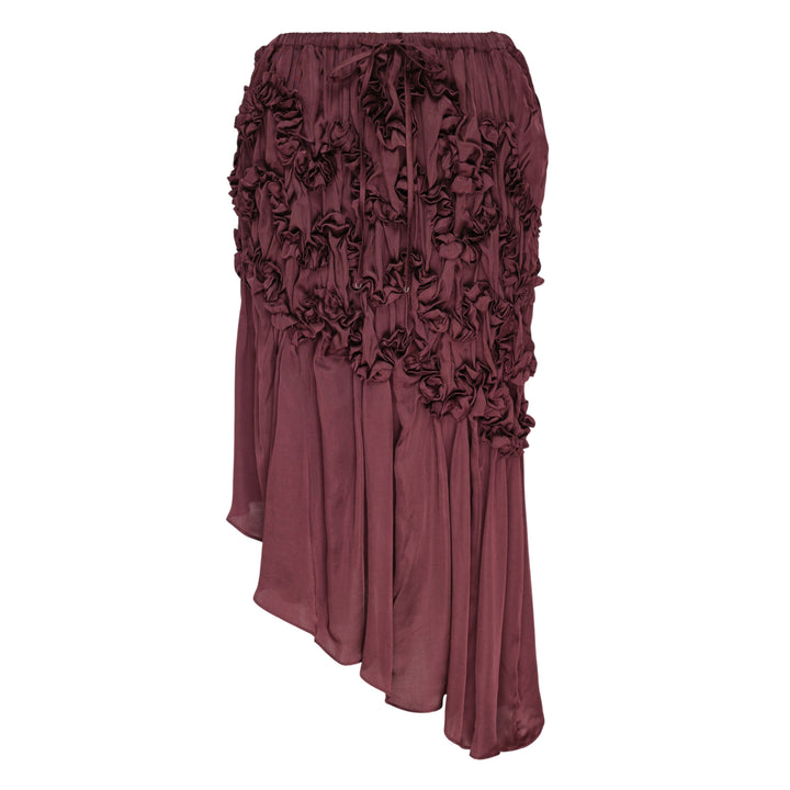 Hisu Park Jenny Skirt in deep burgundy satin with ruched floral-style gathered detailing on the upper skirt and an asymmetric draped midi hem